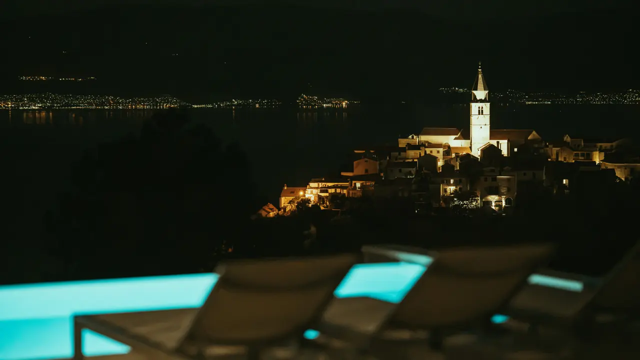 Vrbnik by night seen from the illuminated pool